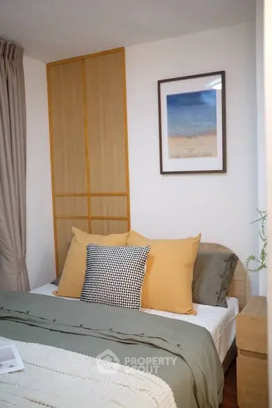 Cozy bedroom with stylish decor and warm lighting