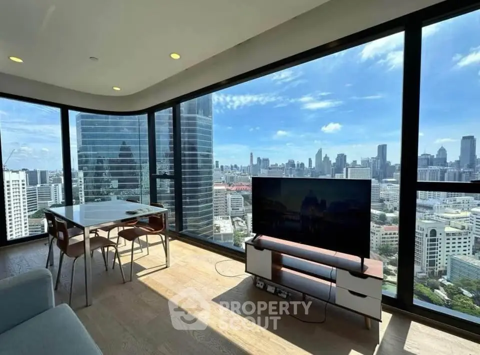 Stunning corner unit with panoramic city views and modern interior design.