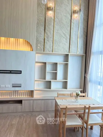 Modern living room with elegant built-in shelves and dining area, featuring floor-to-ceiling windows and stylish lighting.