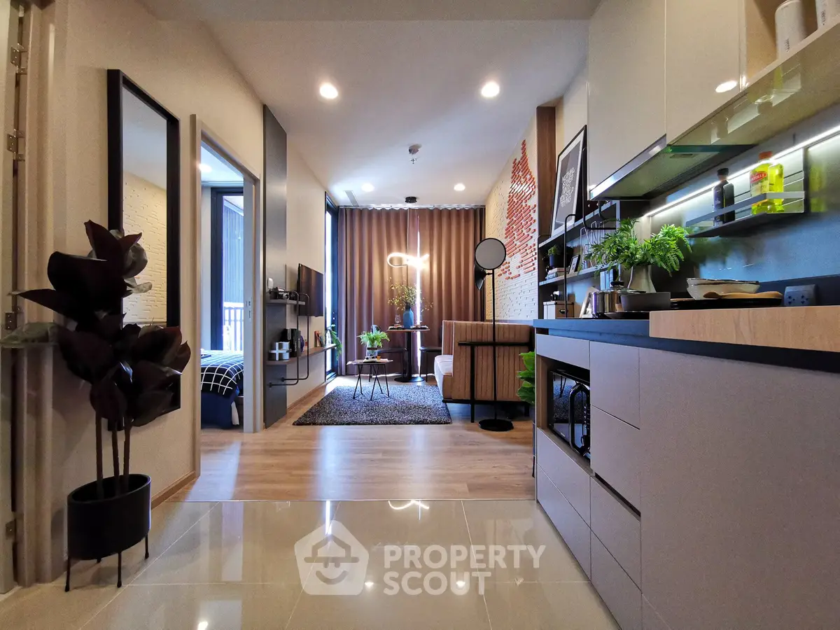 Modern open-plan living room with stylish kitchen and cozy decor