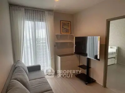 Cozy living room with modern decor and large window view