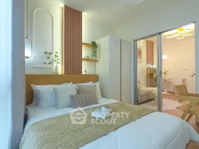 Cozy bedroom with modern decor and sliding glass doors leading to a stylish living area.