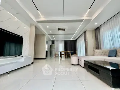 Spacious modern living room with elegant decor and ample natural light