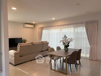 Spacious living room with elegant dining area and modern decor