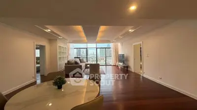 Spacious living room with elegant dining area and city view in modern apartment