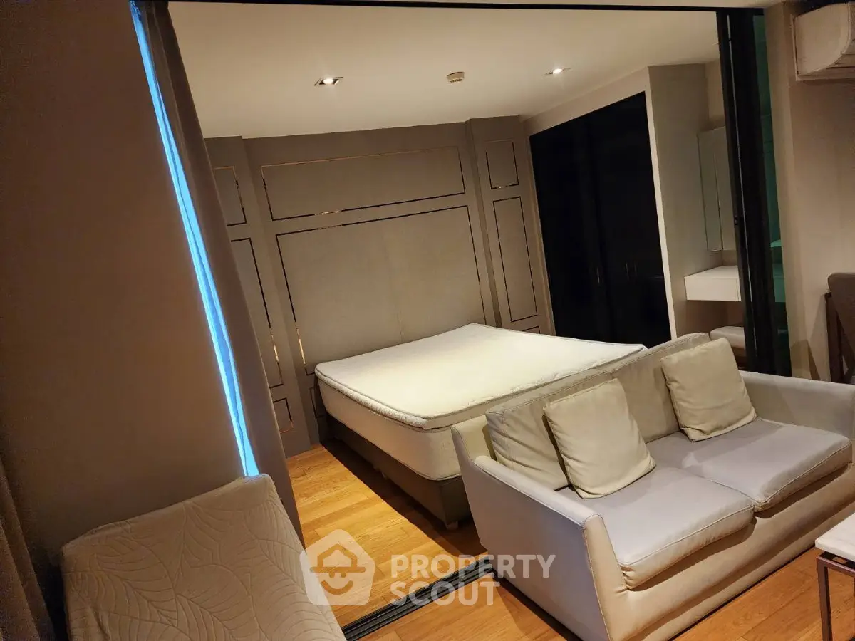 Modern studio apartment with cozy living area and stylish bedroom design