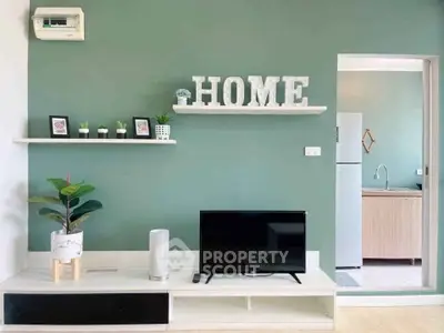 Modern living room with stylish decor and open kitchen view.