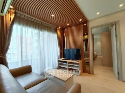 Modern living room with stylish wooden ceiling and natural light