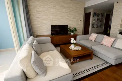Spacious living room with modern decor and cozy seating area