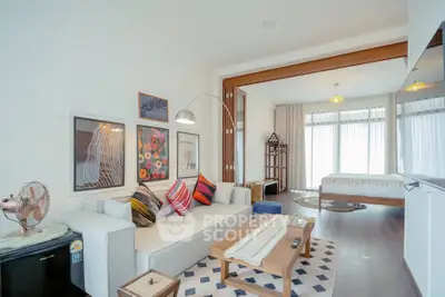 Modern open-plan living room with stylish decor and natural light