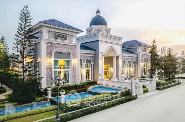 Luxurious mansion with grand architecture and elegant landscaping, featuring a stunning facade and lush gardens.