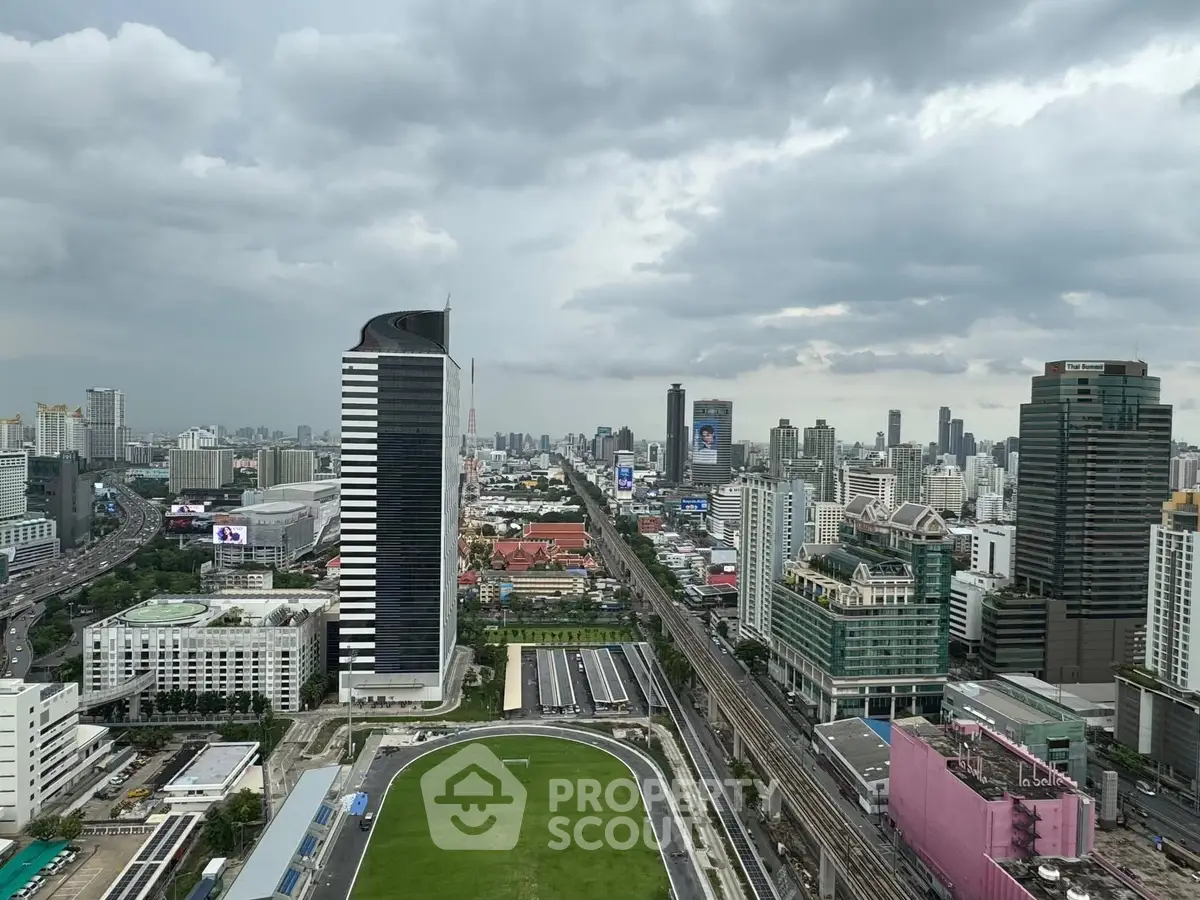 Stunning cityscape view showcasing modern skyscrapers and urban skyline under a cloudy sky.