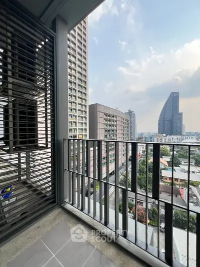 Modern balcony with city skyline view in high-rise apartment