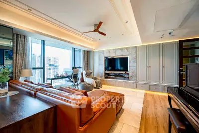 Luxurious living room with leather sofa, large TV, and city view in modern apartment.