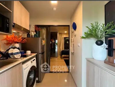 Modern compact kitchen with washing machine and stylish decor
