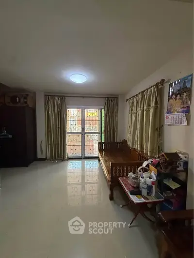 Cozy living room with traditional wooden furniture and natural light