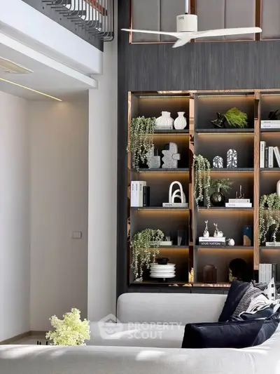 Modern living room with stylish shelving and elegant decor