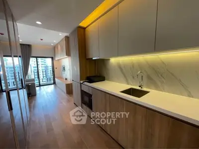 Modern open kitchen with sleek design and city view balcony