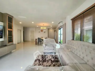 Spacious modern living room with elegant decor and large windows