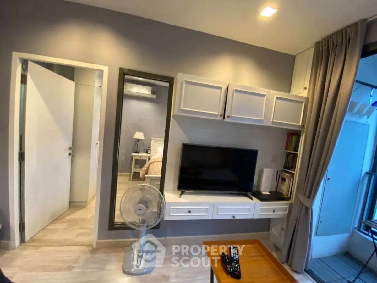 Modern living room with sleek TV unit and cozy decor