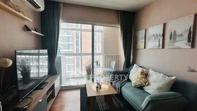 Cozy living room with modern decor and large window view