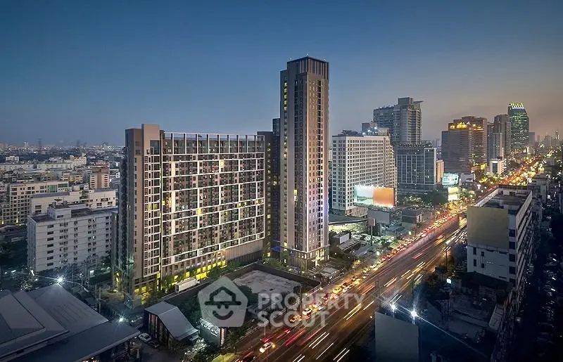 Stunning cityscape view of modern high-rise buildings at dusk, showcasing urban living.