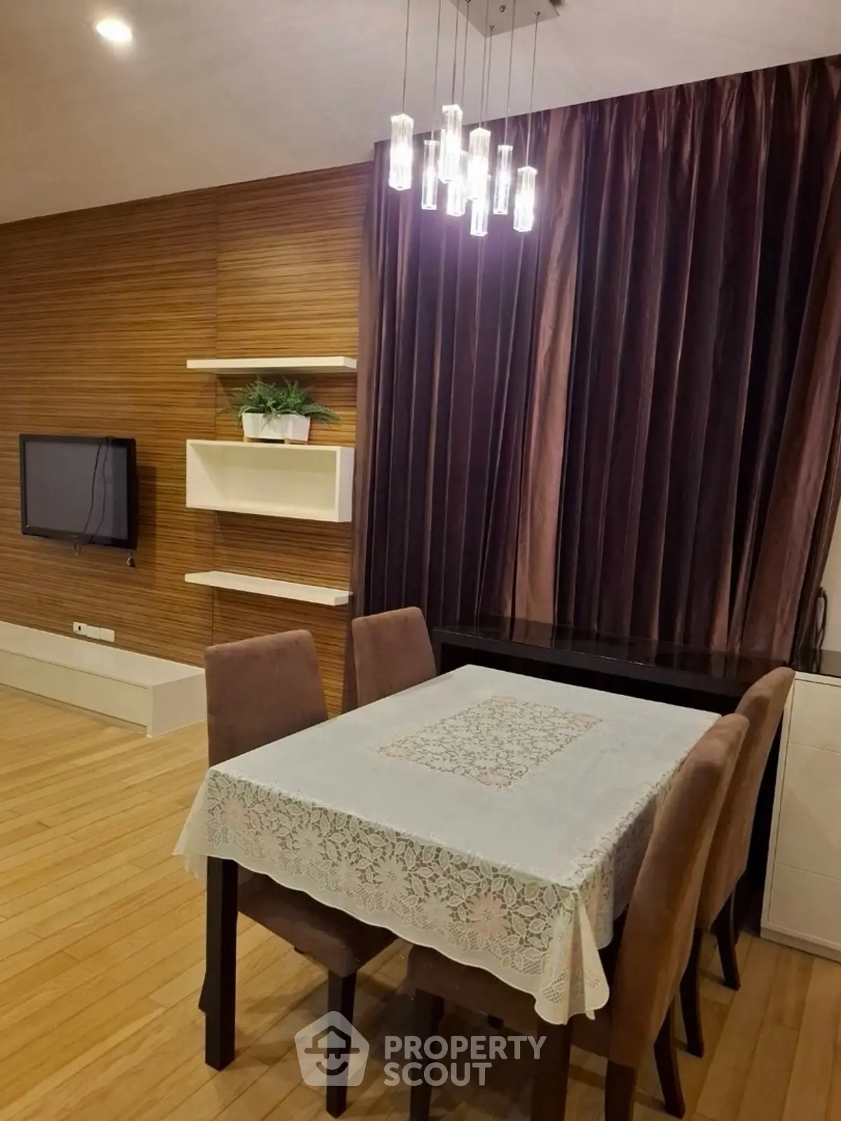 Stylish dining area with elegant lighting and wooden accents