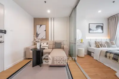 Modern living room with cozy beige sofa and stylish decor in a contemporary apartment.
