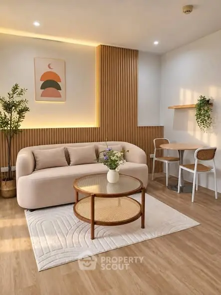 Modern living room with stylish furniture and warm lighting, featuring a cozy sofa and elegant decor.