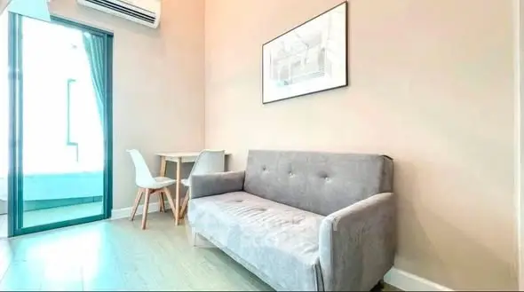 Modern living room with stylish sofa and natural light