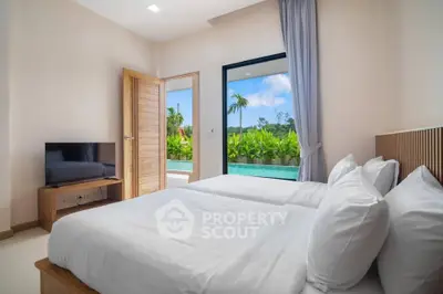 Luxurious bedroom with pool view and modern amenities in tropical setting