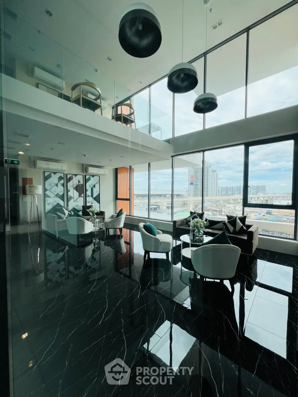 Luxurious high-rise building lobby with panoramic city views and modern furnishings.
