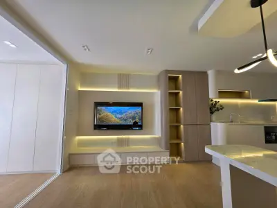 Modern living room with built-in TV unit and stylish lighting