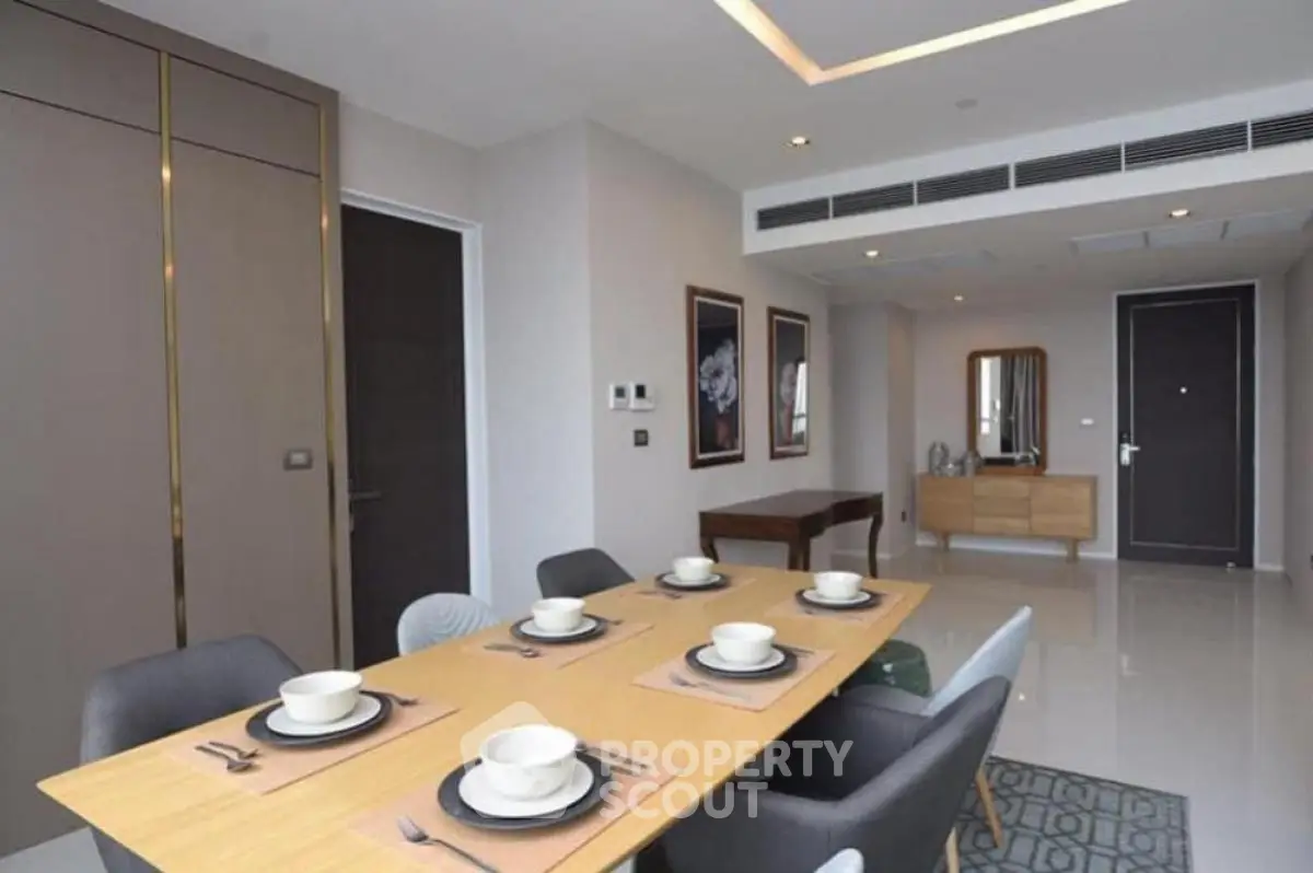 Modern dining area with elegant table setting and sleek interior design