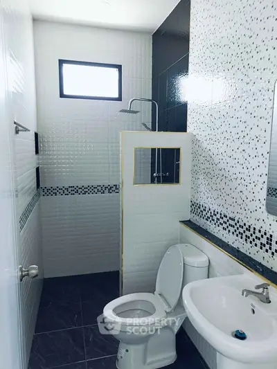 Modern bathroom with sleek tiles and contemporary fixtures