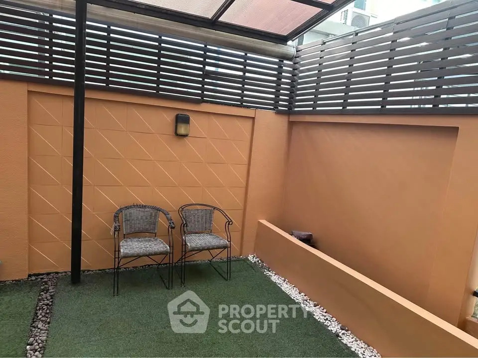 Charming private garden patio with seating area and modern design