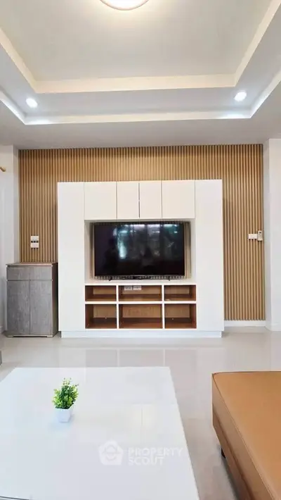 Modern living room with sleek TV unit and stylish decor