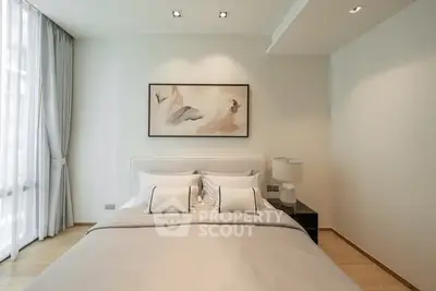 Elegant bedroom with modern decor and natural light