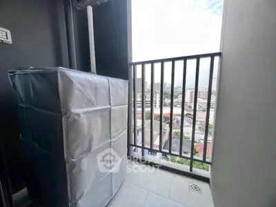 Modern balcony with city view and covered appliance, ideal for urban living.