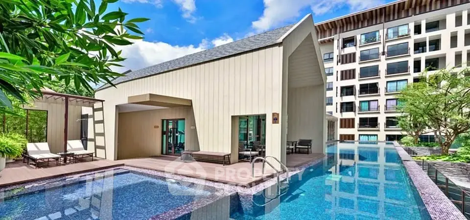 Luxurious modern building with stunning pool and lush greenery, perfect for upscale living.