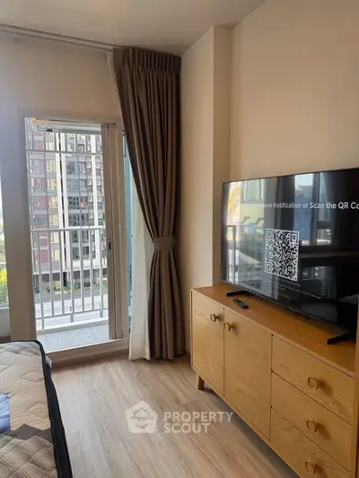 Modern bedroom with balcony view and stylish wooden furniture