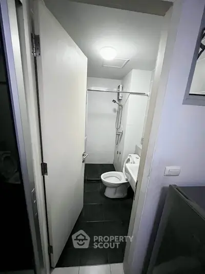 Compact modern bathroom with sleek fixtures and minimalist design