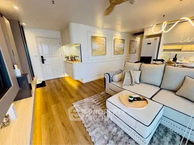 Spacious modern living room with elegant decor and open kitchen layout