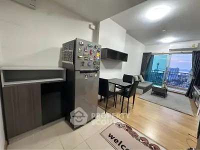 Modern open-plan living room with kitchen and balcony view
