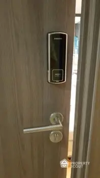 Modern door with electronic lock in contemporary apartment