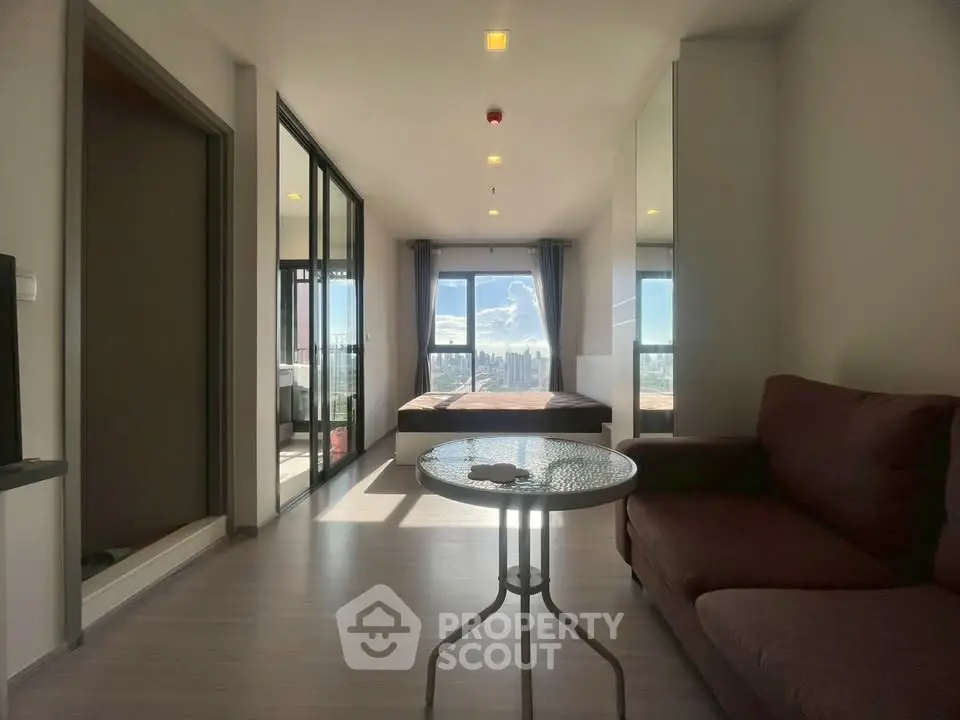 Modern living room with panoramic city view and cozy furnishings