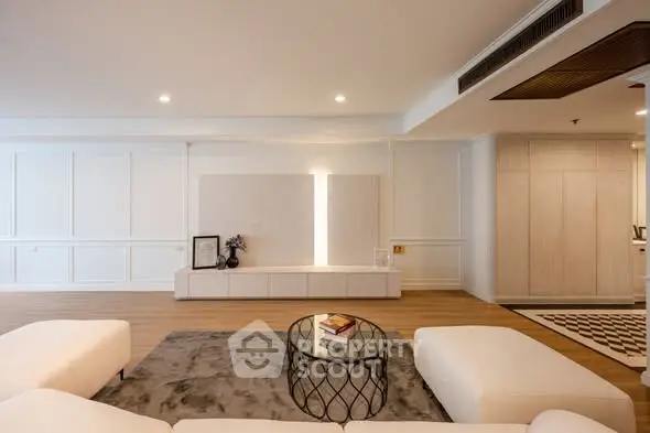 Spacious modern living room with elegant decor and cozy seating area.