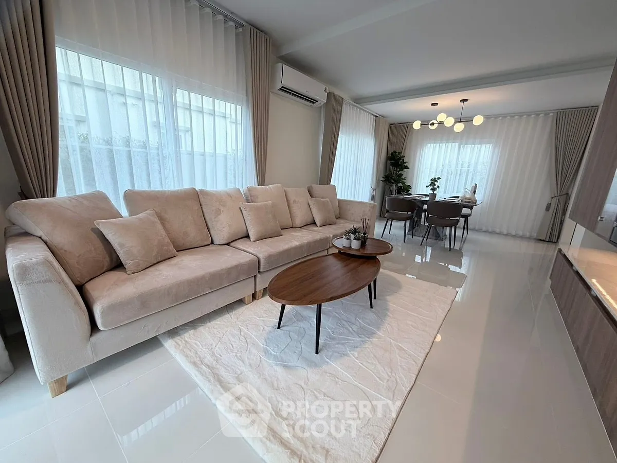 Spacious modern living room with elegant decor and natural light