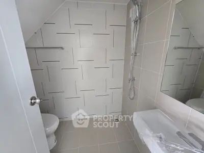 Modern bathroom with sleek tile design and shower area