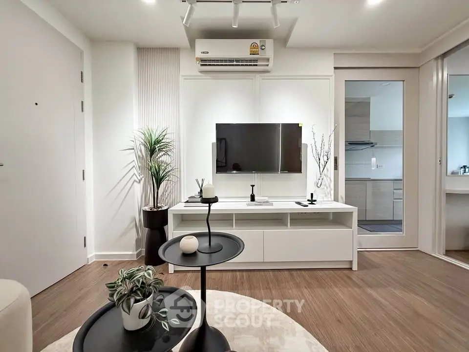 Modern living room with stylish decor and open kitchen layout